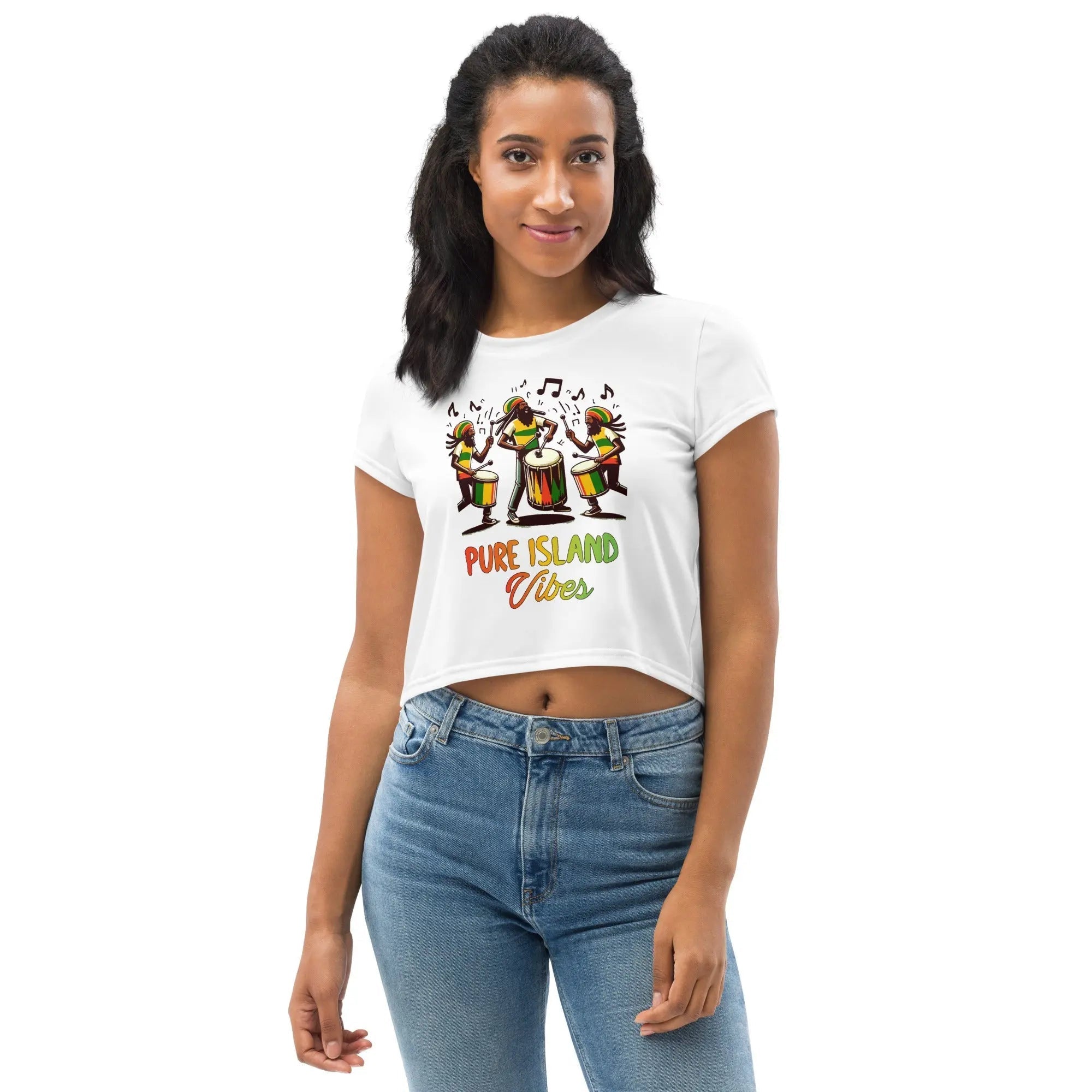 Woman wearing Pure Island Vibes all-over print white crop tee with colorful drummer graphic and blue jeans