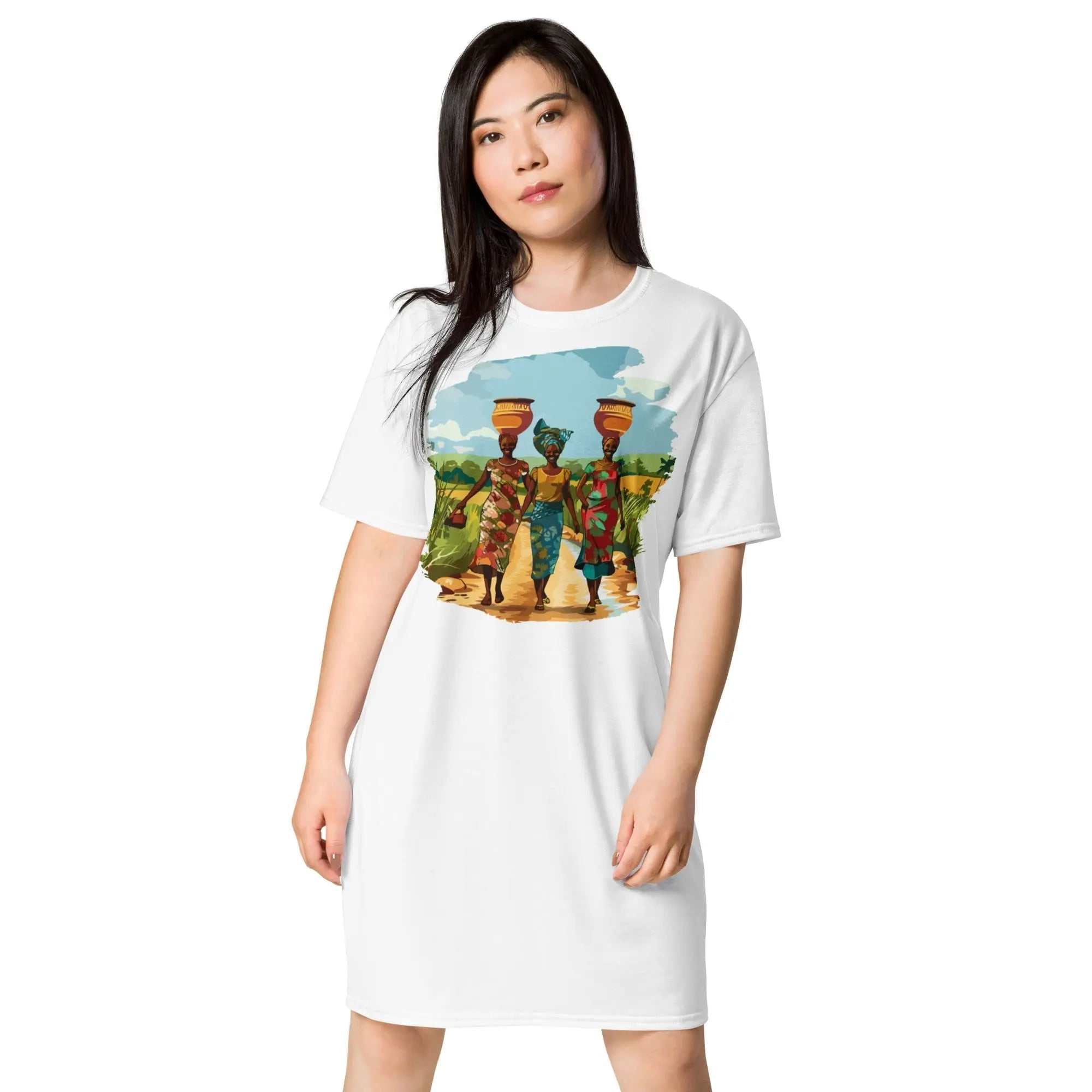 Africa Vibes Ladies Tall Comfort T-Shirt Dress featuring African women in traditional attire carrying water pots under a serene sky on white background
