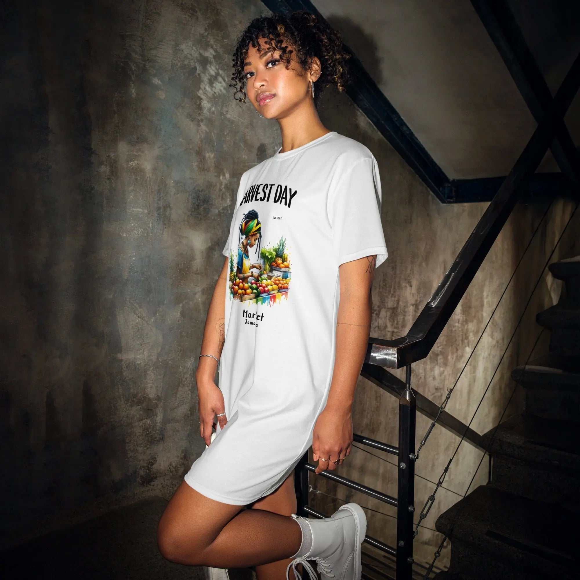 Woman wearing white Harvest Day Market ladies comfort tall t-shirt dress with Rastafarian vendor and colorful fruits design