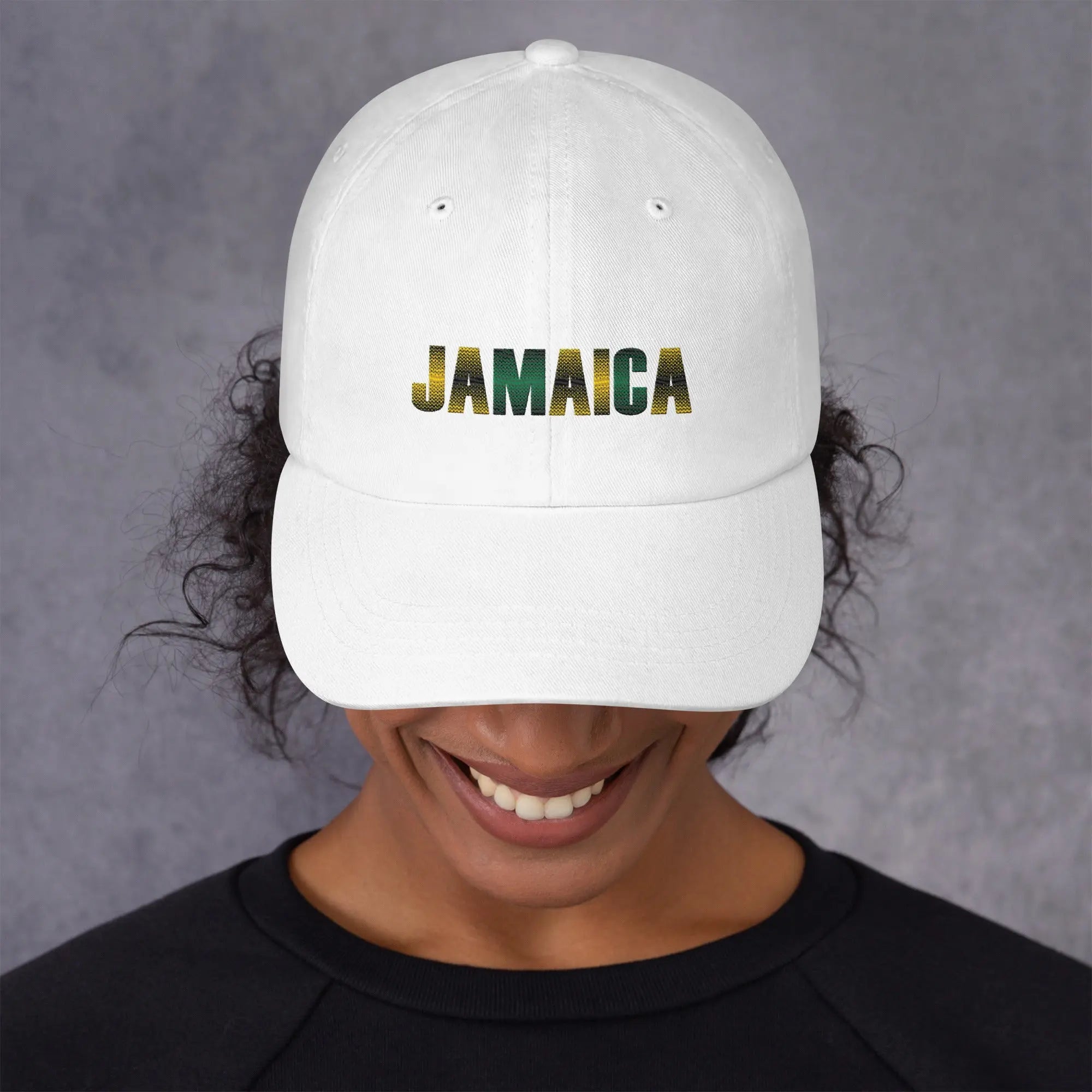 white Jamaica unisex dad hat with embroidered logo worn by person smiling