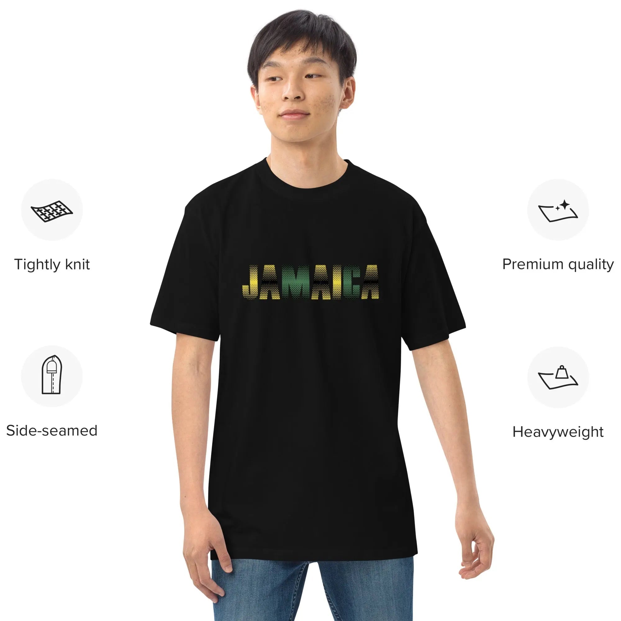 Model wearing black Jamaica Out Of Many One People men's premium heavyweight tee with gold lettering, featuring tightly knit, side-seamed, and durable cotton fabric