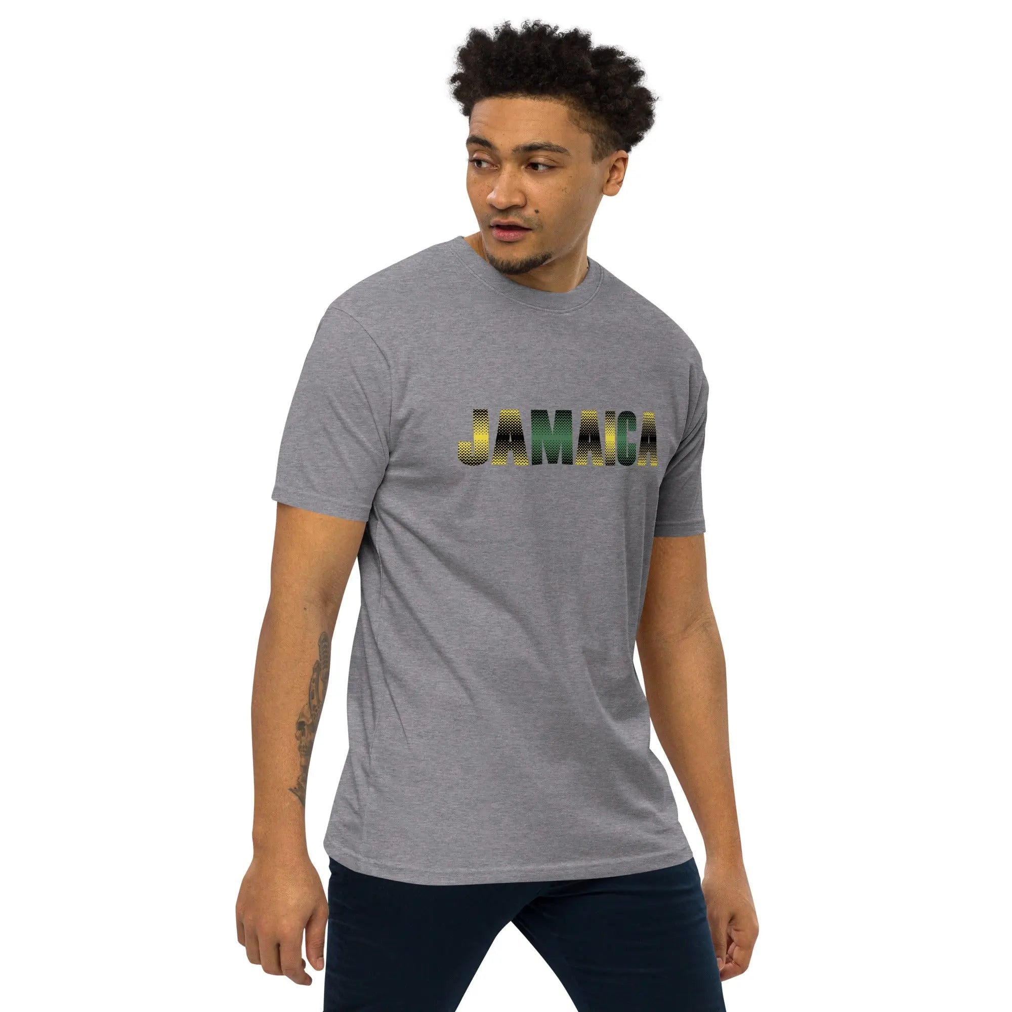 Man wearing Jamaica Out Of Many One People men's premium heavyweight gray t-shirt with printed text