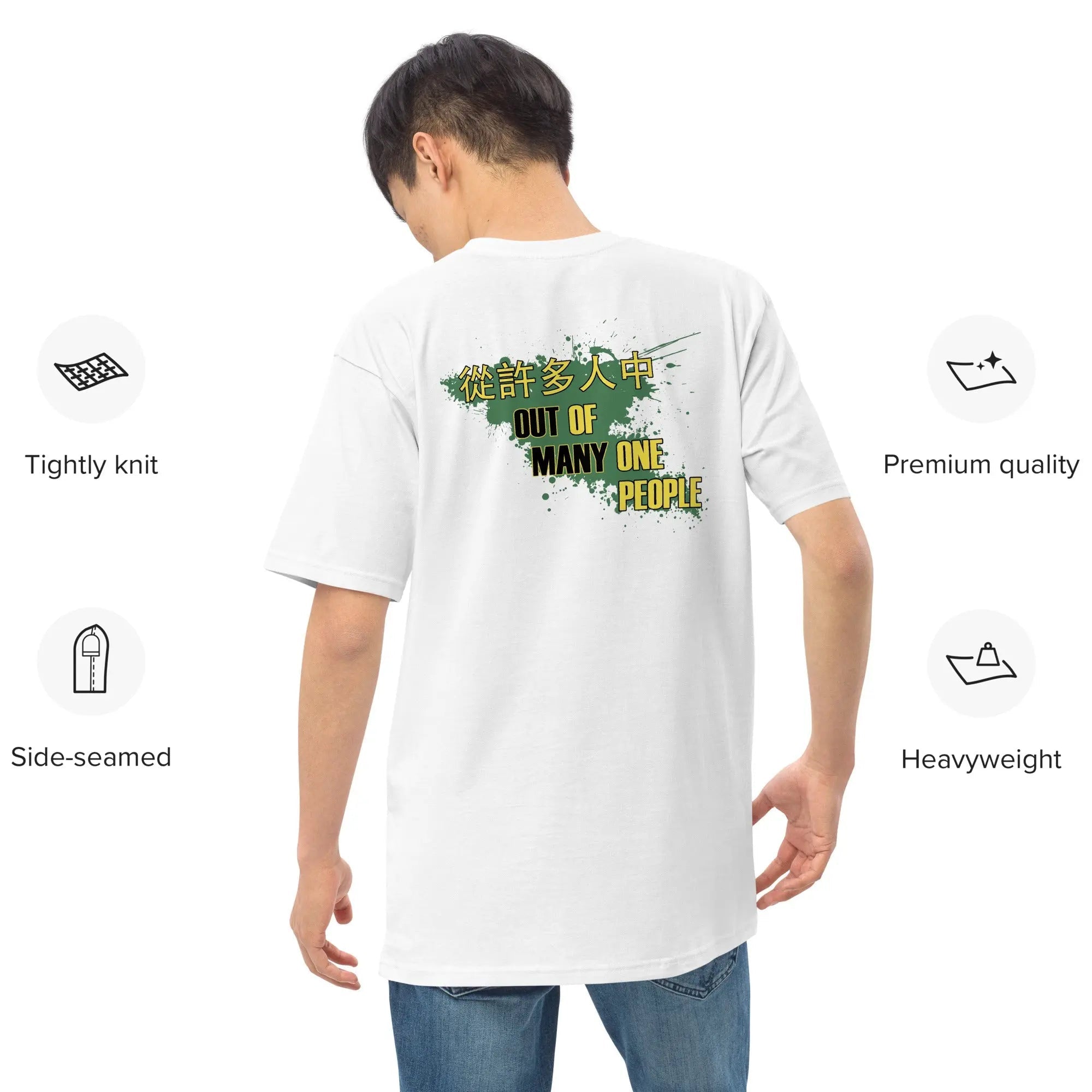 Man wearing white Jamaica Out Of Many One People premium heavyweight tee with graphic text on back, showcasing durable, soft, 100% combed cotton fabric and side-seamed construction.