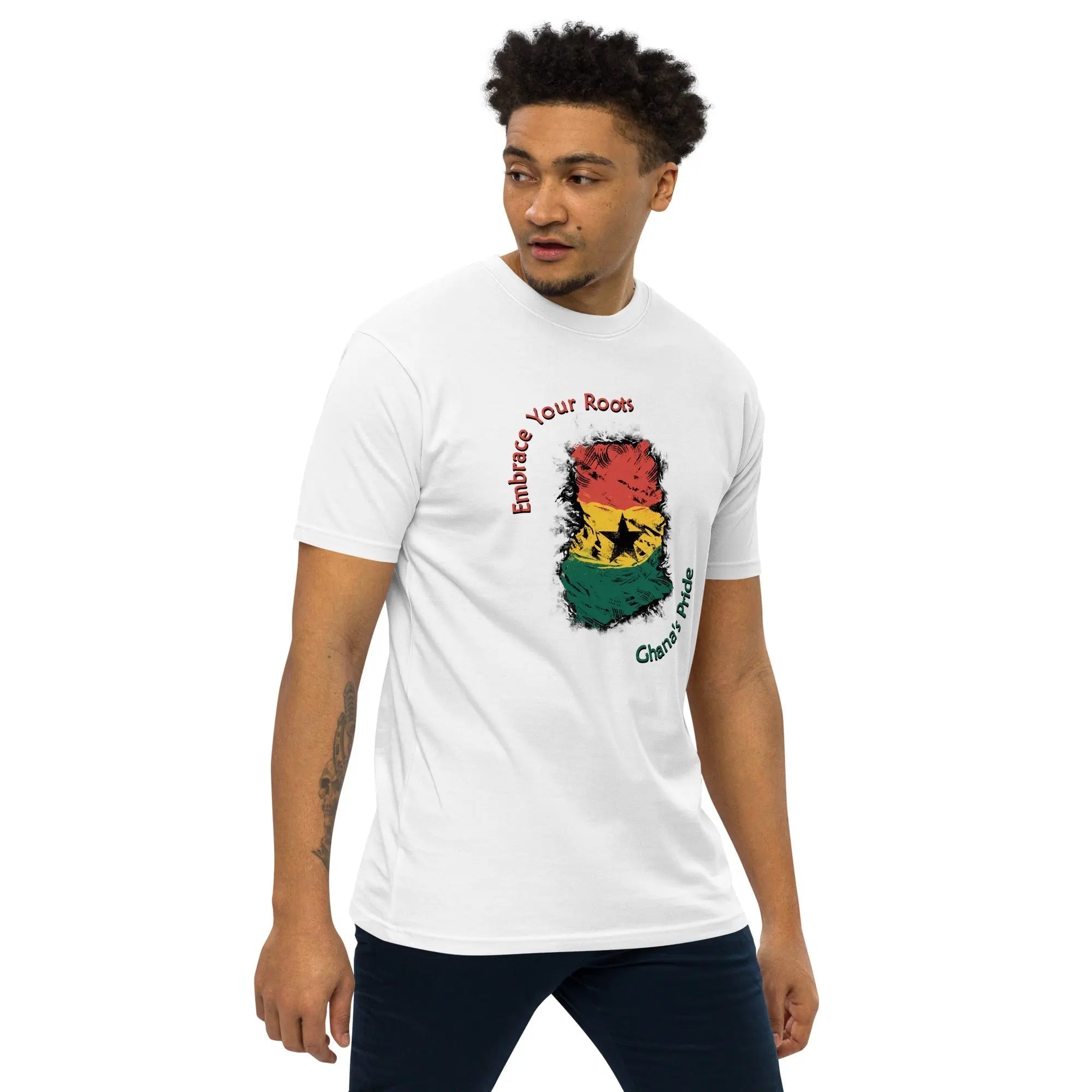 Men's white heavyweight tee with colorful Ghana flag design and "Embrace Your Roots" text, showcasing Roots Of Ghana's Pride theme