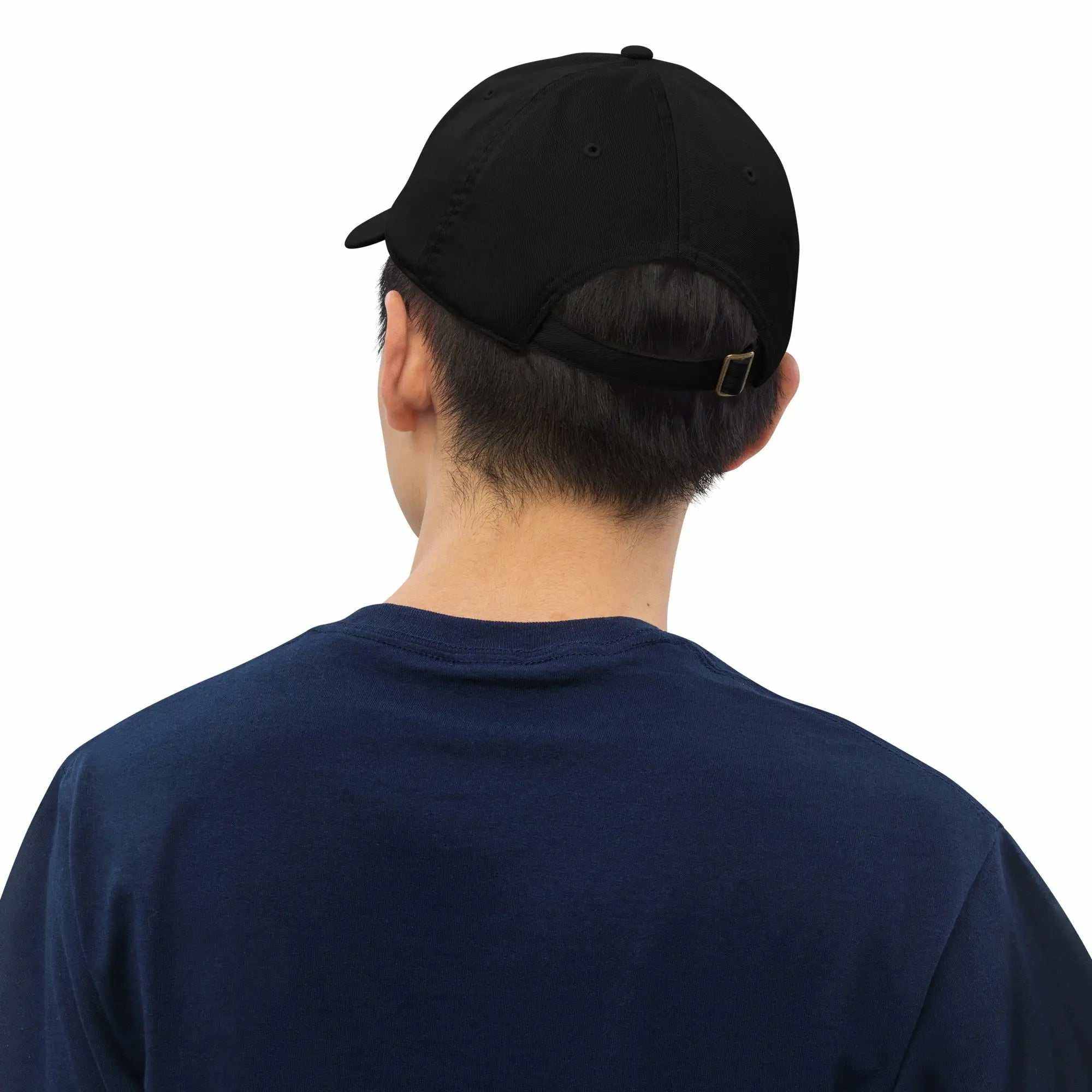 Black Organic Roots Of Africa dad hat made from 100% organic cotton with adjustable brass slider closure worn on a person viewed from the back
