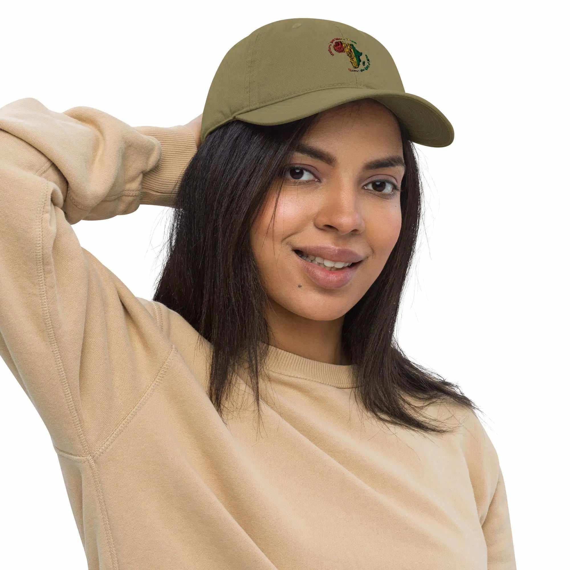 Woman wearing an olive green Organic Roots Of Africa dad hat made from 100% organic cotton with embroidered African design