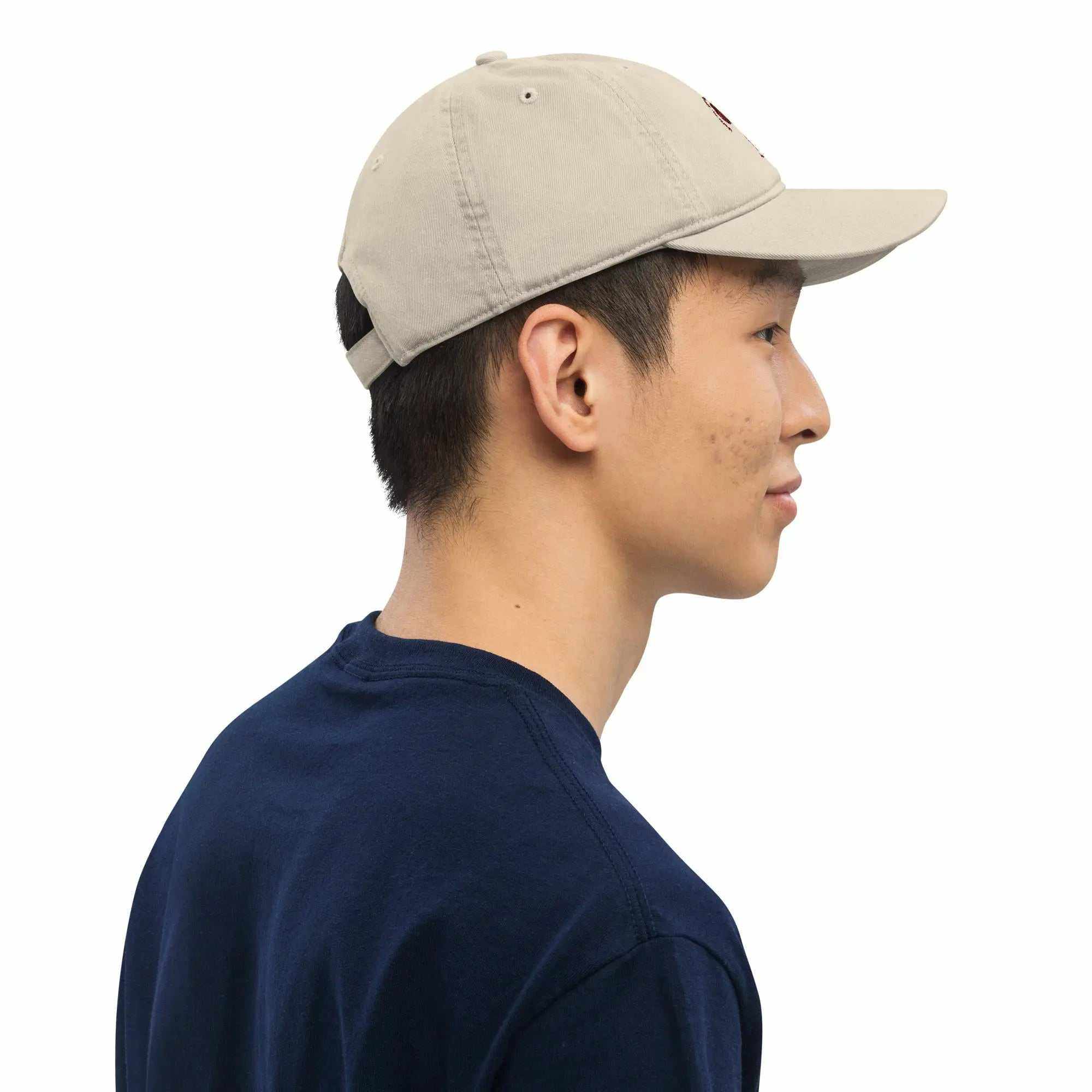Side view of man wearing beige Organic Roots Of Africa dad hat made from 100% organic cotton
