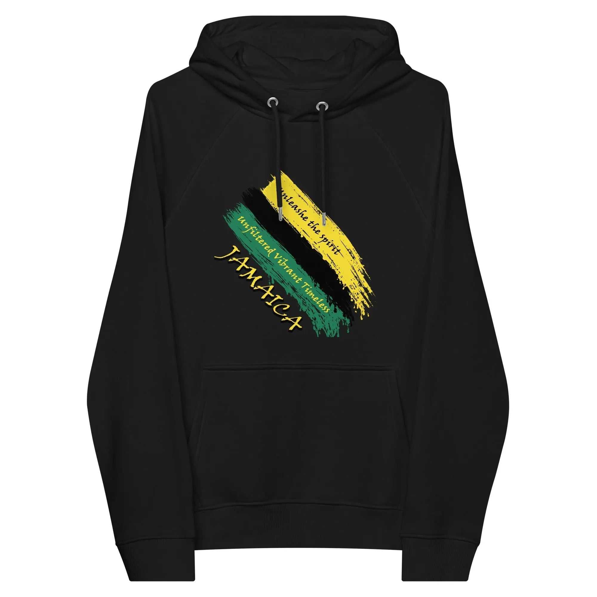 Black unisex eco raglan hoodie featuring Jamaica Unfiltered Brushstroke Flag design with yellow, green brushstrokes and text.