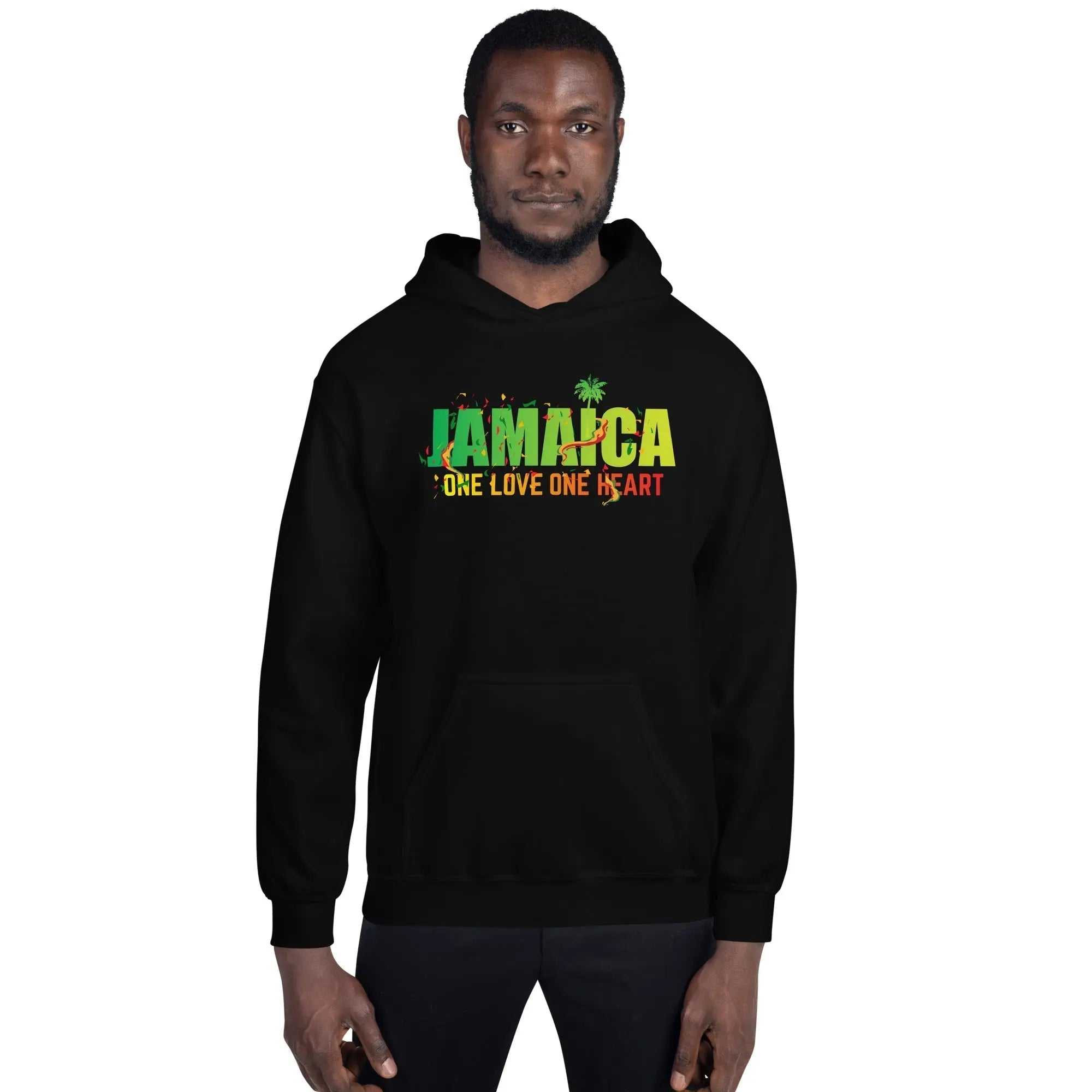 Man wearing black One Love One Heart hoodie with colorful Jamaica text and palm tree design