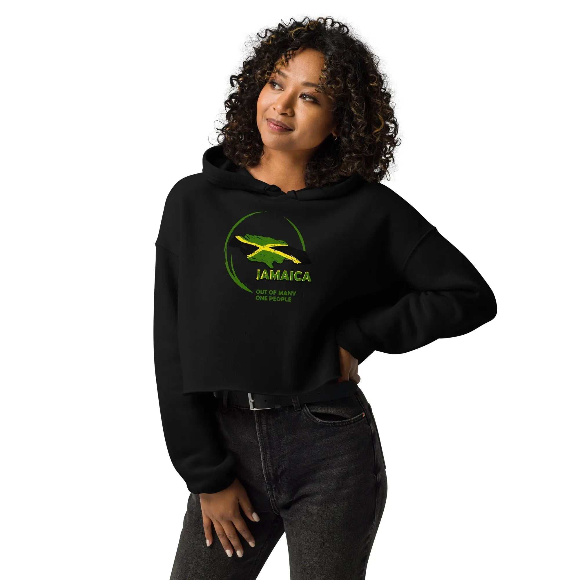 Woman wearing black cropped hoodie with yellow and green Jamaican flag design and "Out Of Many One People" text