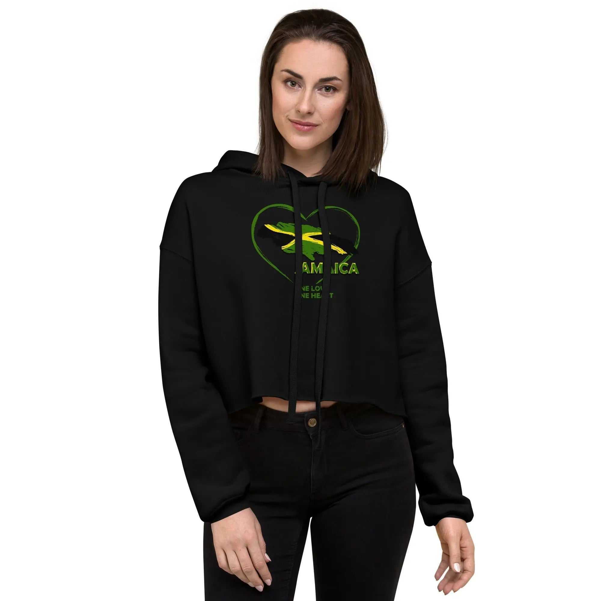 Woman wearing black One Love One Heart crop hoodie with raw hem and heart design on front