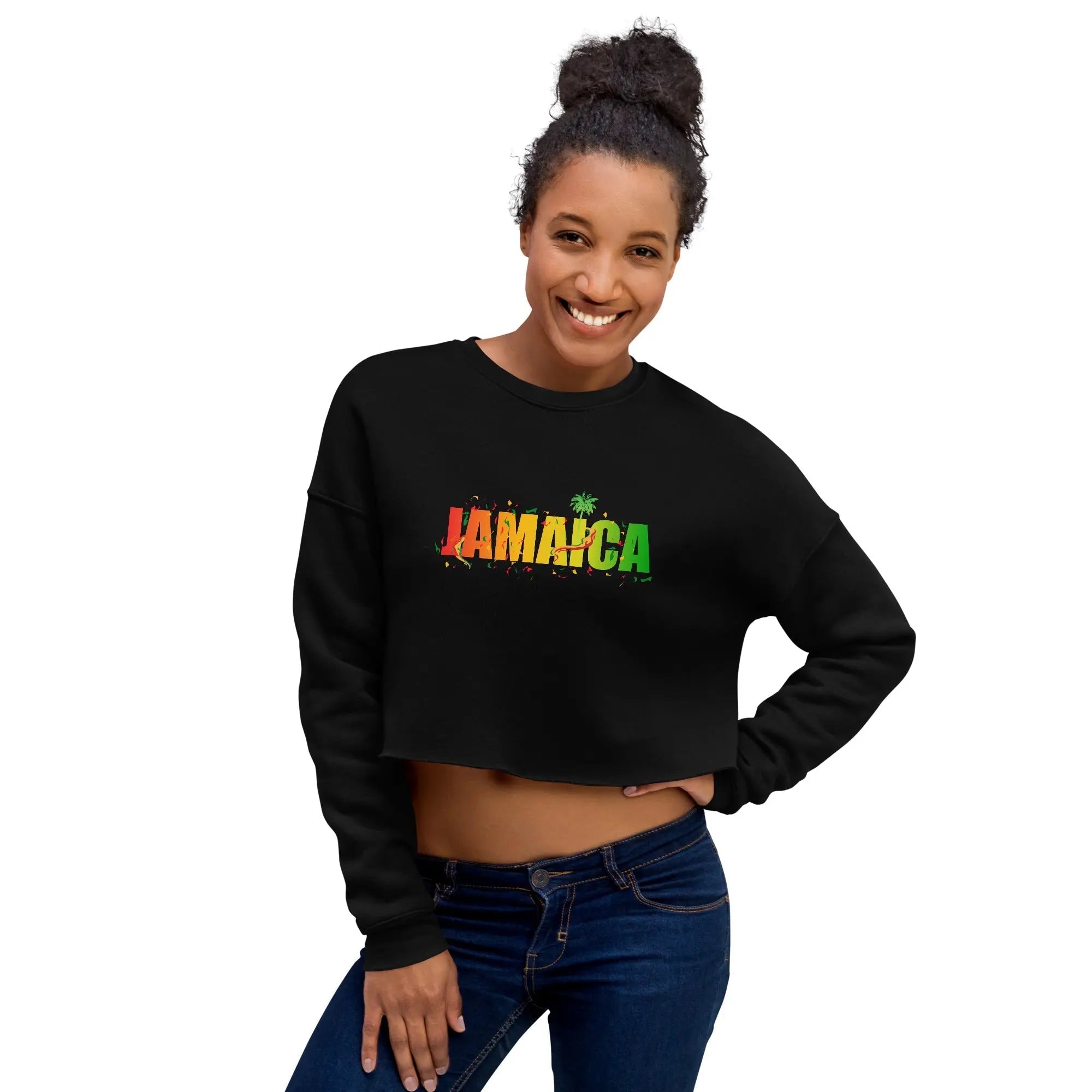Woman wearing black cropped sweatshirt with colorful "Jamaica" tropical design text celebrating Jamaica Out Of Many One People
