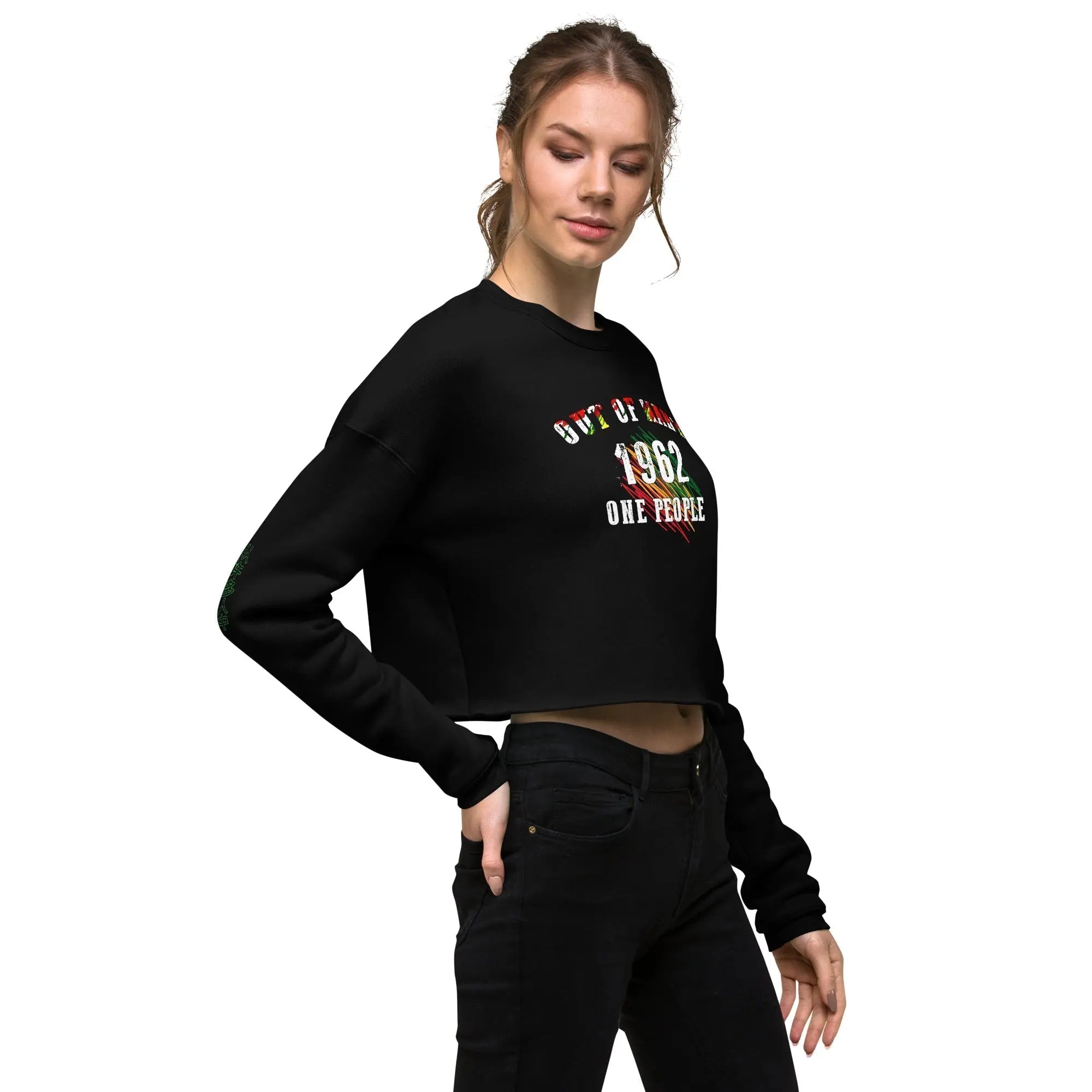 Women wearing black Out Of Many One People crop sweatshirt with 1962 graphic celebrating Jamaican independence